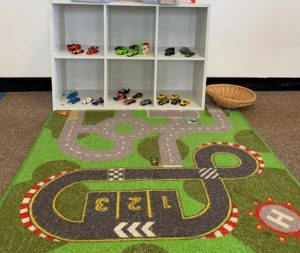 Photo of a road play map and toy cars